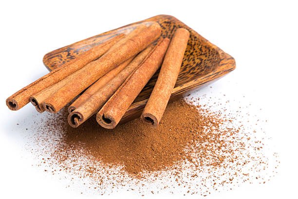 Bowl of cinnamon on a heap.
